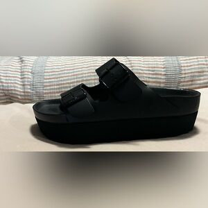 I am selling these black thick sole sandals.